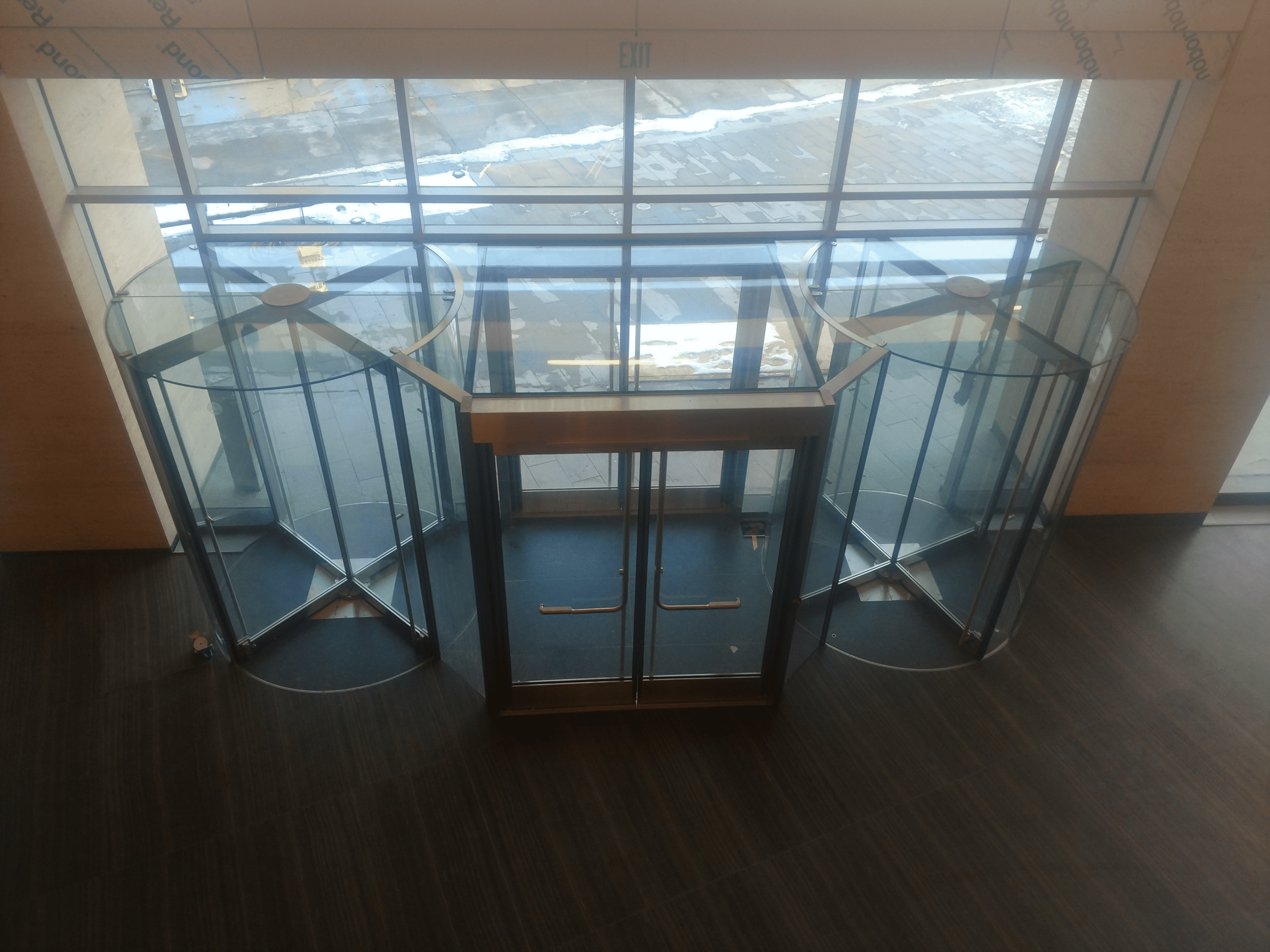 Aluminum door repair service by Horizon Glass near me, featuring a modern revolving door in Colorado