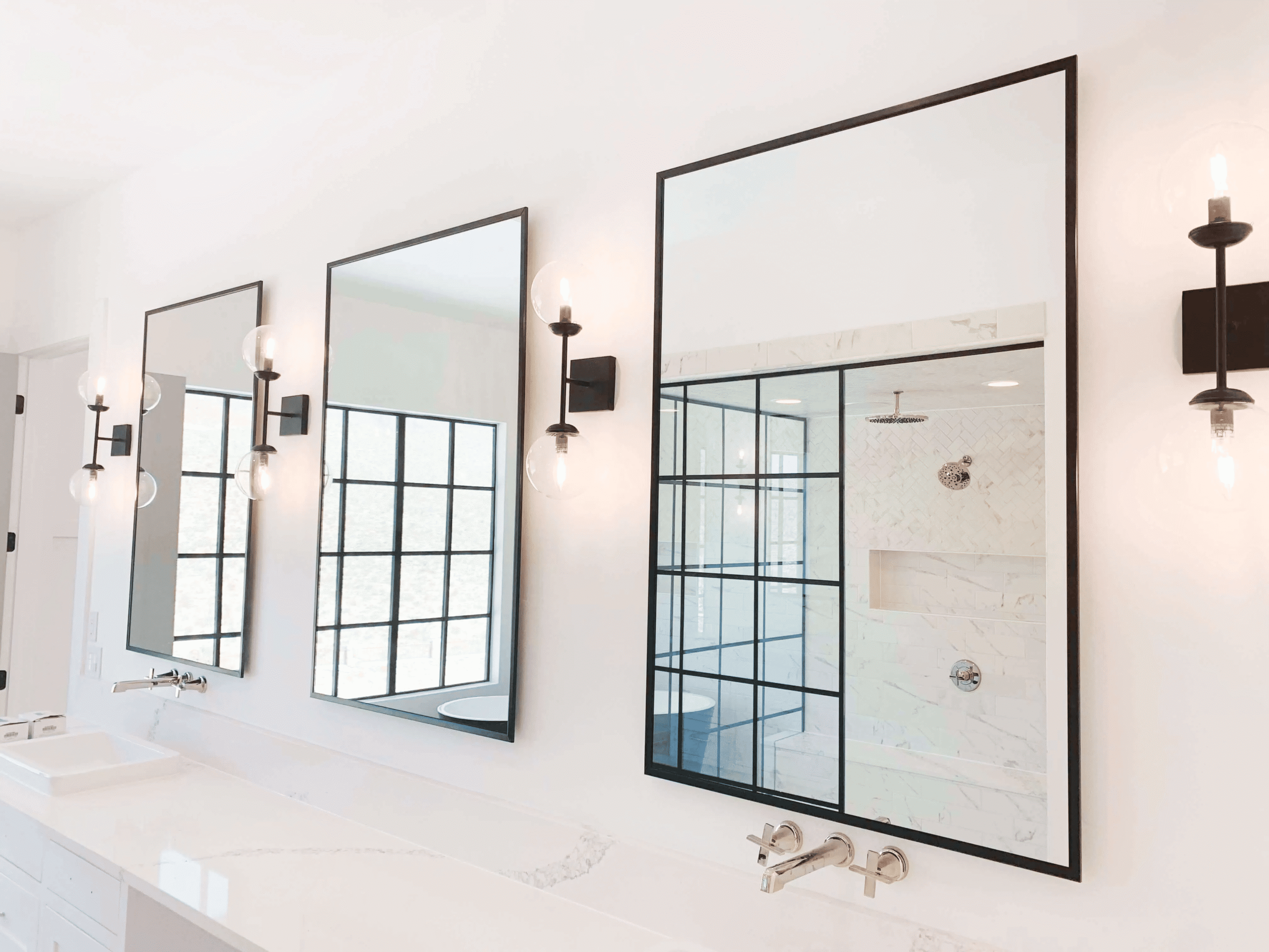 Custom mirrors installed by Horizon Glass, enhancing a bathroom near me with elegant modern design.