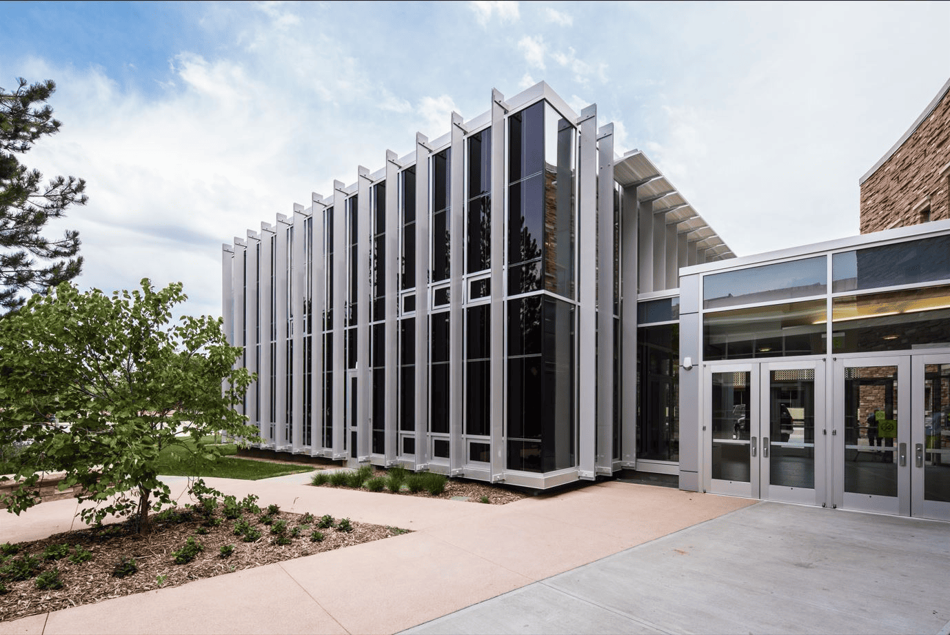 Modern building featuring switchable privacy glass installed by Horizon Glass near me