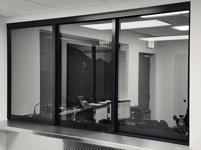 Modern transaction window installed by Horizon Glass in Colorado, providing a clear view for service near me.